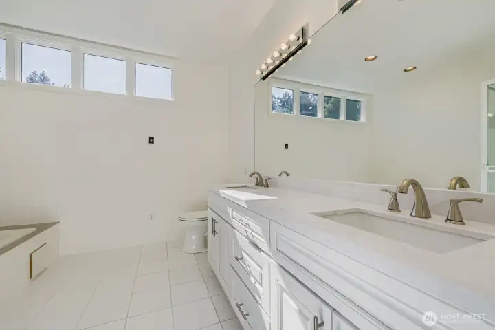 5 Piece in the Primary Bathroom with jetted tub and brand new countertops and sinks and faucets.