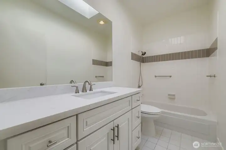 newly updated bathroom with brand new cabinets and countertops.