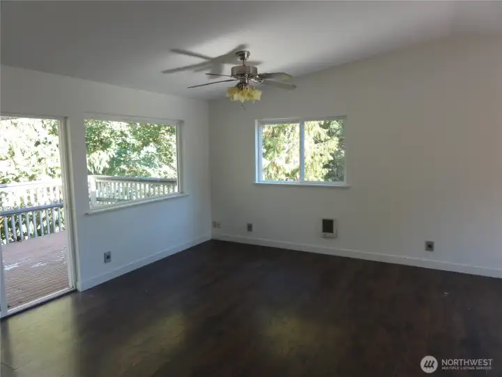Open concept. Family room off kitchen. Sliding glass door opens to huge deck.