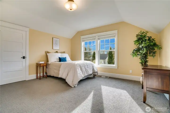 The second upstairs bedroom offers endless flexibility—think guest space, home office, or a hobby space.