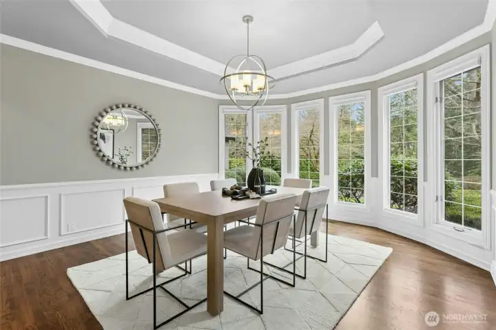 The formal dining space with more picturesque views easily accommodates a statement table.
