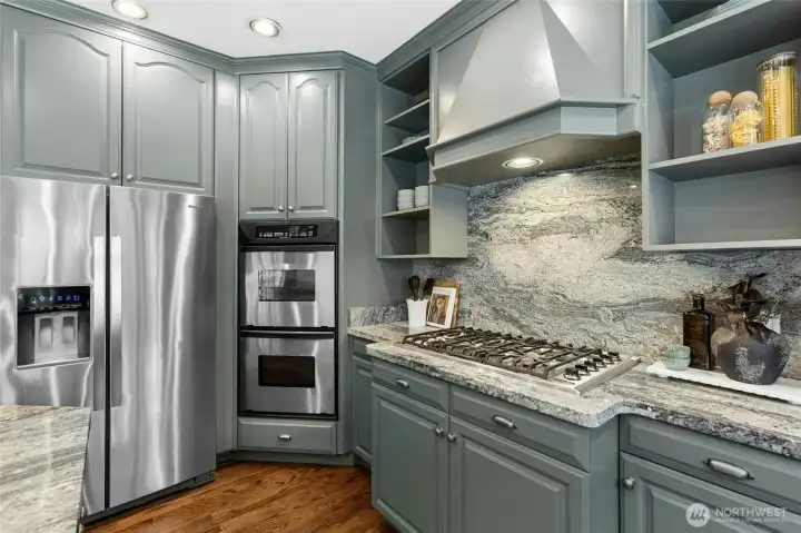 6-burner gas cooktop with dual ovens + built-in microwave.