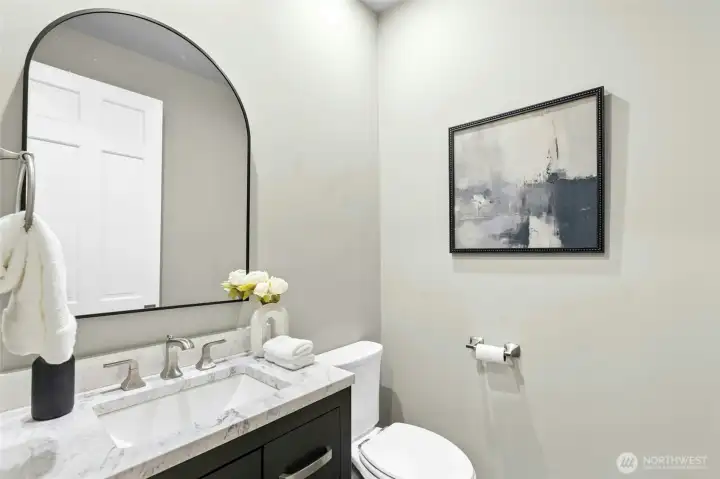 1 of 2 main floor powder rooms.