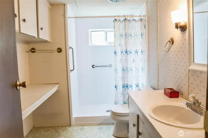 Bathroom features newer fiberglass insert.