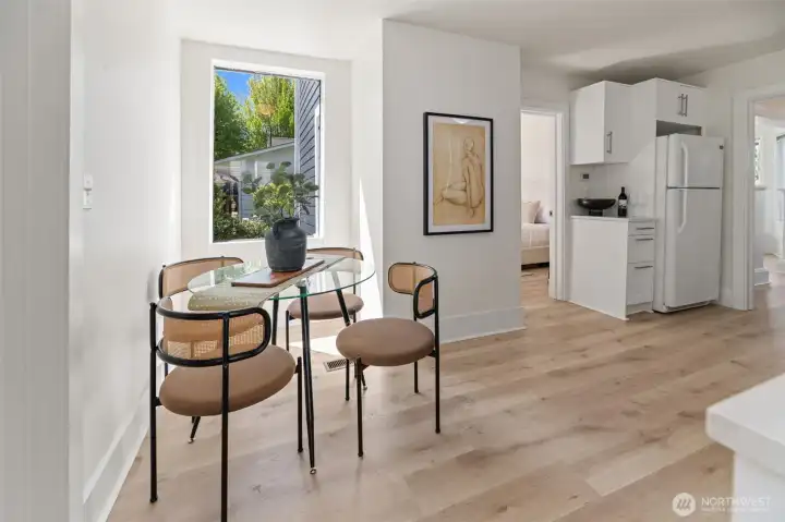 The kitchen has space for a dining table and chairs.