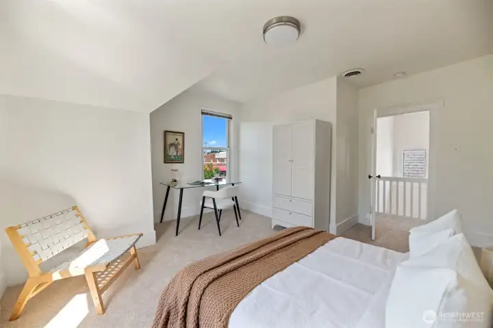 Another view of this bedroom. Enjoy beautiful sunsets from this west-facing window.