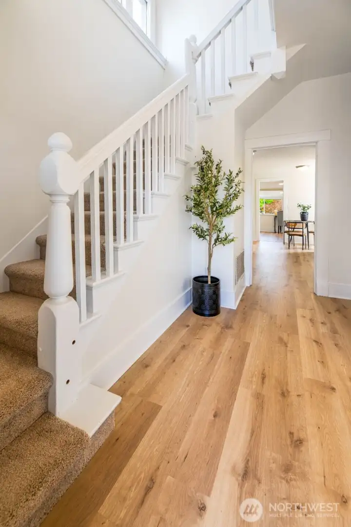 The entry and staircase is quite grand. This move-in-ready home is freshly painted inside and out with all new flooring!