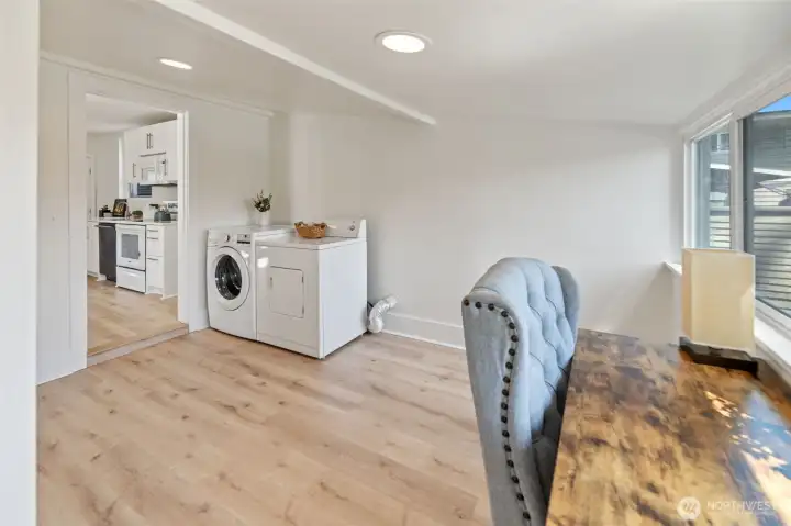 The laundry is located in a large room on the main level. There is plenty of room to add a folding table or whatever you would like to make your laundry room a happy place.
