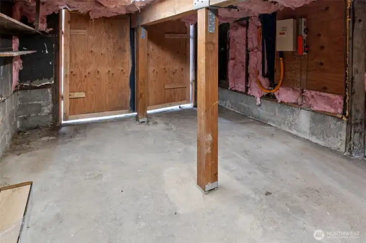 The garage is under the laundry room and was fortified with posts and beam. It's a great place for storage!