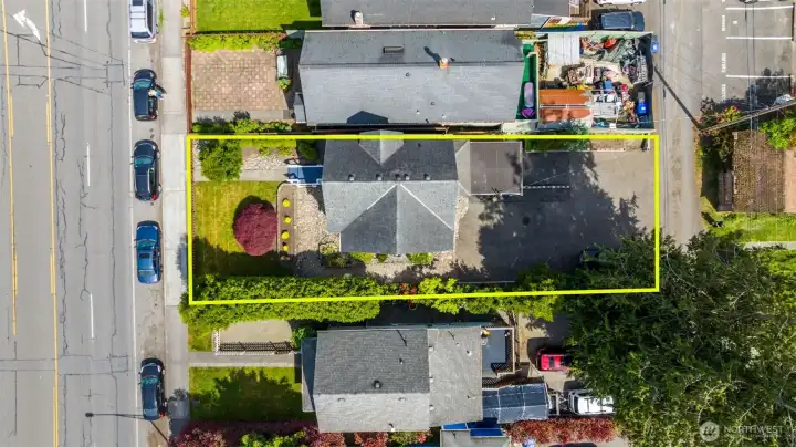 Lot size is 5,663 sq ft (approximate lines) with alley access. This street was zoned B1 which means - could be residential or business. In 2025 new zoning is UR7 - which means in the future - this lot along with the neighbors could be up to 7 stories high! Buy now, enjoy the current property and get great return on your investment in the future! Home was recently updated to residential code.