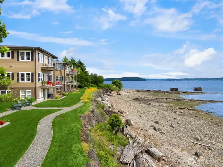 This southeast-facing view from the private beach shows Blake Island in the distance, and the Washington State Ferries travel through the waterway throughout the day.