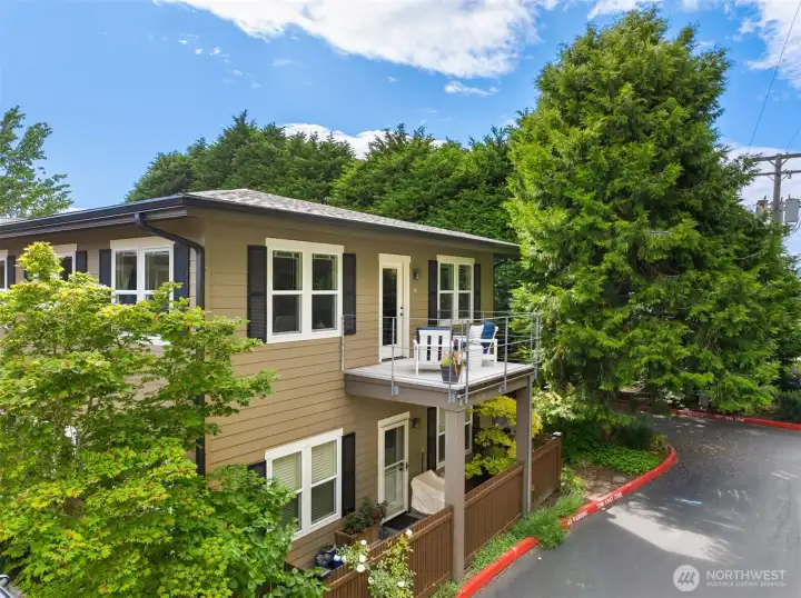 The spacious private deck extends directly off the great room and is buffered from the street by the garage and mature landscaping.