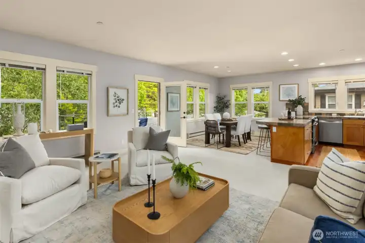 The large great room combines the living room, dining room, and open kitchen into one bright, cohesive gathering space