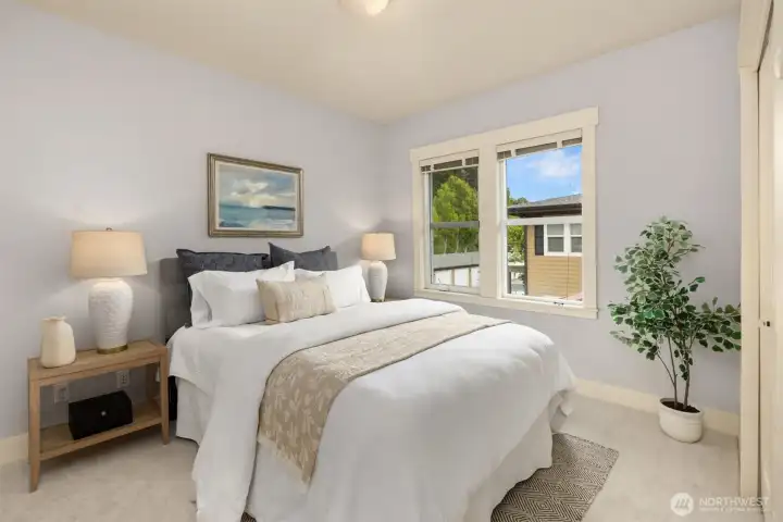 The second bedroom is conveniently located near the hall bath, offering easy access for guests or daily use.