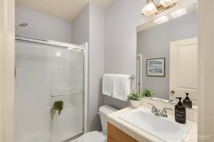 The second bathroom is a polished space, reflecting the same care and quality found throughout the home.