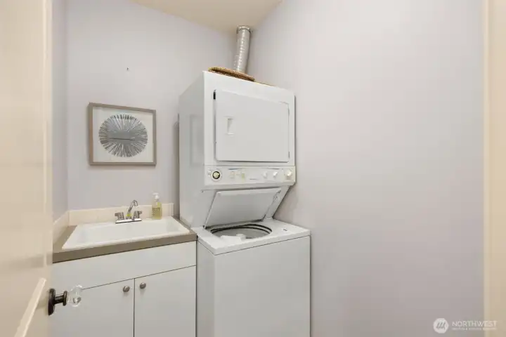 The convenience of in-unit laundry adds to the home's comfortable and functional design.