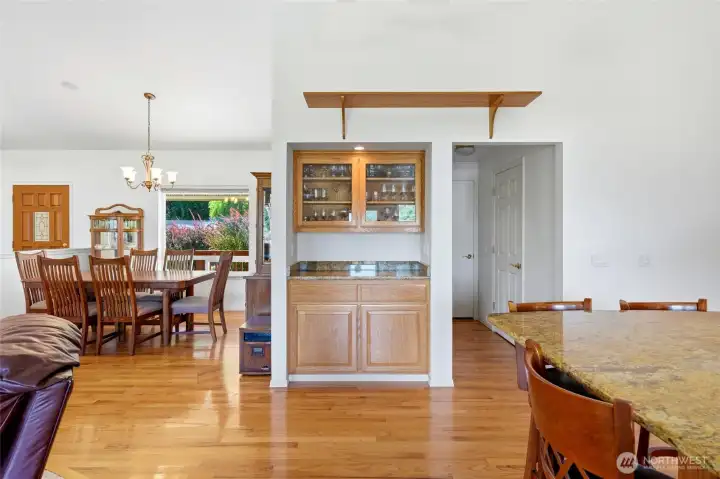 Well-positioned beverage station. Pantry, laundry/half bath, & garage to the right, down a short hallway.