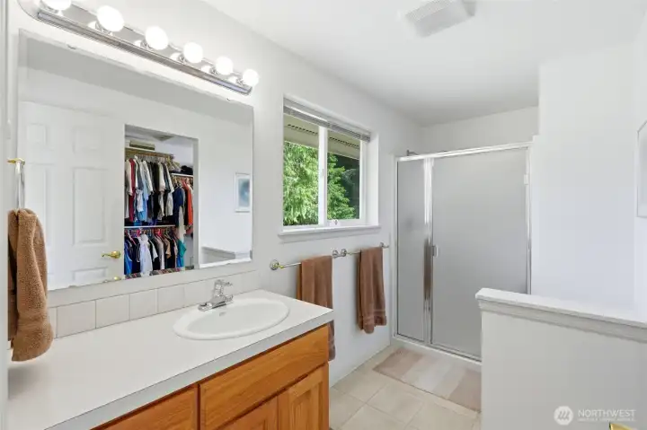 Primary 3/4 bathroom with walk in closet