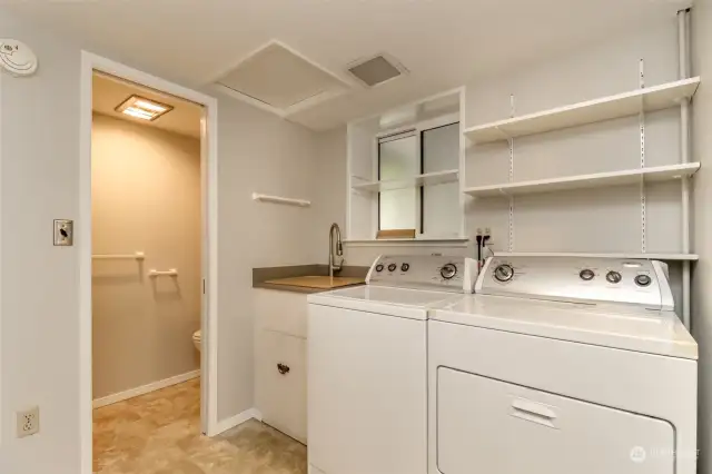 The laundry room is on the lower level and there are two 1/2 baths downstairs as well.