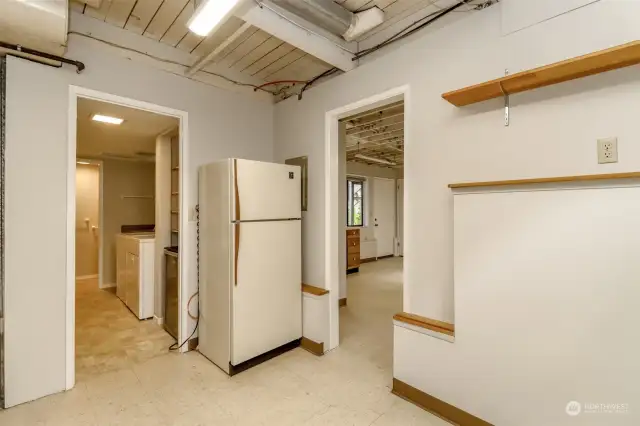 Downstairs includes a fireside office/(4th bedroom), the laundry room, this storage room, and the large craft room.