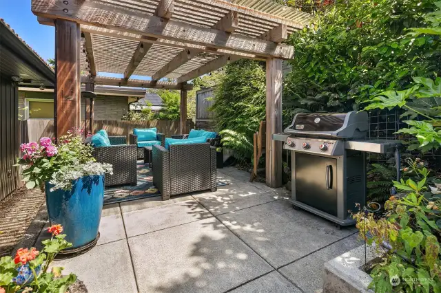 The beautifully landscaped backyard with a custom pergola provides a private oasis for alfresco dining, entertaining and relaxation. Makes entertaining a breeze.