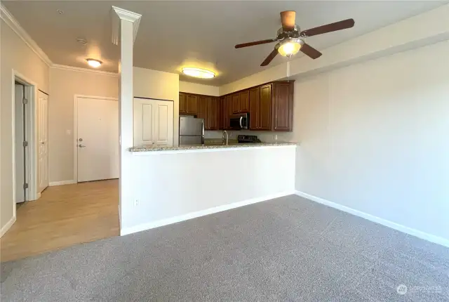 Effortless Entertaining in Style  The open dining area, just off the kitchen, is perfect for hosting gatherings both big and small. A stylish ceiling fan adds comfort and ambiance, while the seamless flow between spaces makes entertaining effortless and enjoyable.