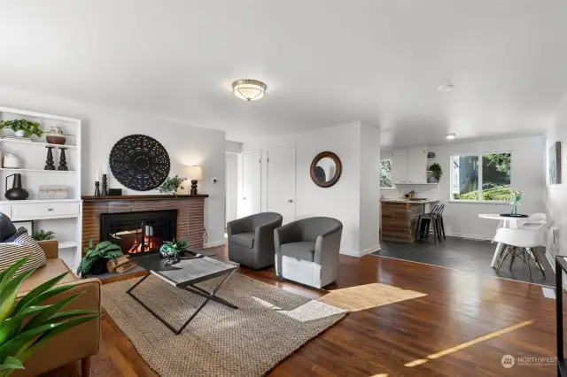 Enter to THIS Beauty :) Notice the hardwoods, traditional fireplace, built-in bookshelf, updated fixtures and bright sunlight coming through the front window.