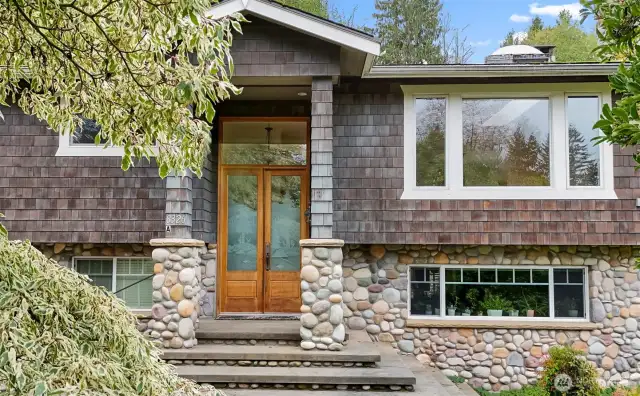 Grand Entrance to the Upper Level of the Home thru the Double Door with Etched Glass & Transom~River Rock Accents the Home & Stairway~One of a Kind Custom Features~