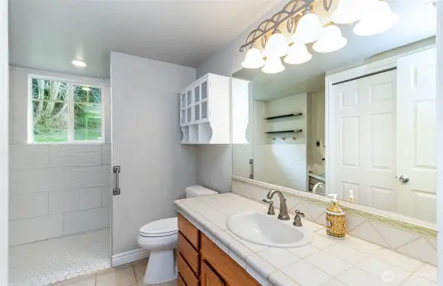 Main Level Bathroom has been Modified to Allow a Wheelchair to Enter the Shower~Hook ups for a Stackable Washer & Dryer are also Located here~
