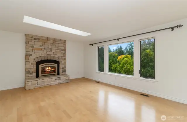 Floor to Ceiling Stackstone Gas Fireplace & Hearth~Oversized Skylight~Front Window Overlooks the Expansive Property~Gardens~Greenhouse & Courtyard~