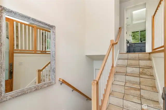 Grand Entrance Door~ Stairs Down go to the Main Level of the Home & Stepping up Leads to the Upper Level of the Mid*Entry Home~