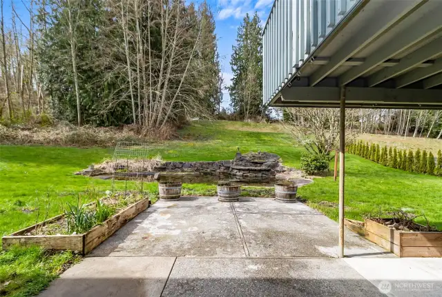 Bulbs & Herbs Poke up out of the Raised Beds with Hopes of an Early Spring~ Partially Covered Deck overlooks the Water Feature~Songs of Peepers & Bullfrogs Echo thru the Air~