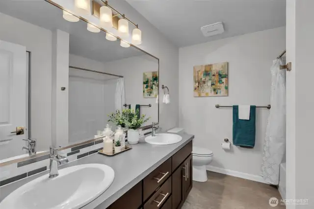 Main hall bathroom with two sinks.