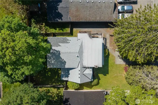 Roof patch from fallen tree branch repair.