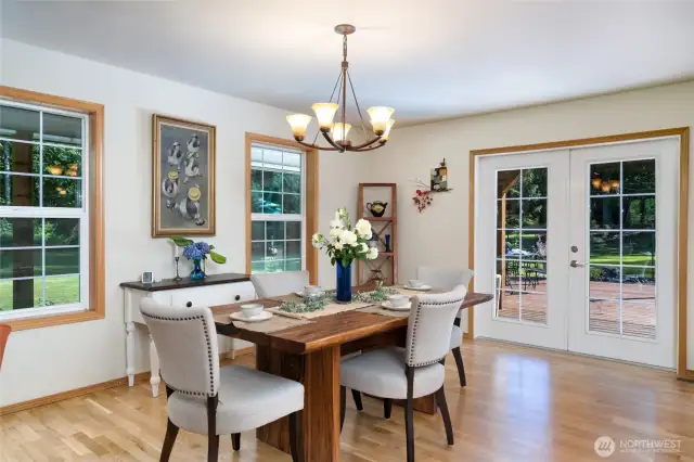 Enjoy meals in the formal separate dining room, featuring charming French doors that lead directly to the back patio—perfect for indoor-outdoor entertaining and easy access to alfresco dining.