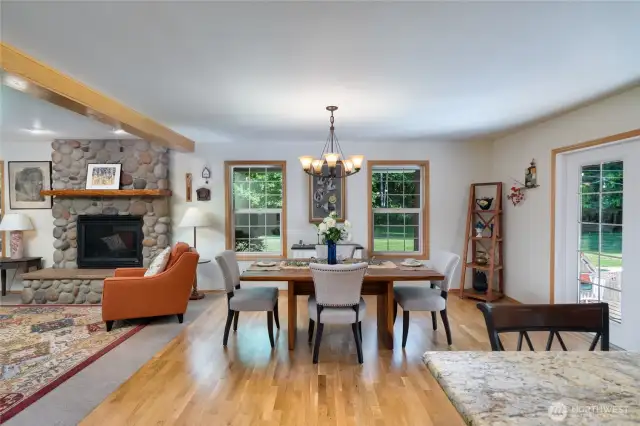 Enjoy a spacious, open-concept layout where the kitchen, dining, and living rooms flow seamlessly together—perfect for hosting friends and family. The cozy fireplace adds warmth and charm, creating an inviting atmosphere for any occasion.