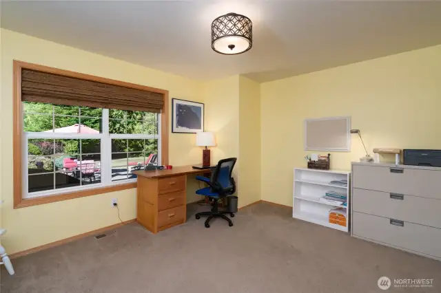 The first-floor office offers a quiet workspace with windows facing the front of the house, providing natural light and a pleasant outlook—ideal for productivity and focus. Great for working from home.
