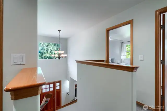 Step through the front door into a bright entryway featuring a staircase that leads gracefully to the second floor, setting the tone for the home’s open and spacious layout.
