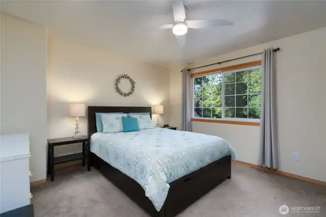 This roomy second-story bedroom provides plenty of space to create a comfortable desk or study nook, ideal for homework, remote work, or hobbies.