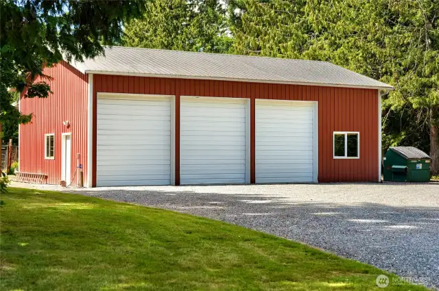 This spacious, insulated shop is designed for year-round use and comfort. A wood-burning stove adds warmth and ambiance, perfect for chilly workshop days. Large 12-foot bay doors provide easy access for RVs, boats, and all your toys—combining function with easy access.