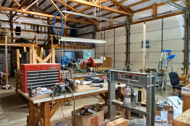 A spacious loft above the shop provides ideal storage for camping gear, ski equipment, or seasonal decorations, keeping your essentials organized and out of the way. Below, large 12-foot bay doors offer easy access for RVs, boats, water toys, and off-road vehicles, making it simple to pull in, park, and go.    Whether you're an adventurer, hobbyist, or just need serious storage space, this setup delivers both function and flexibility for all your gear.