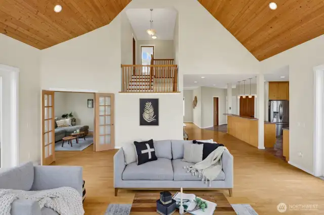 The vaulted ceilings in the great room lovely. Note the open floor plan with the kitchen and family room