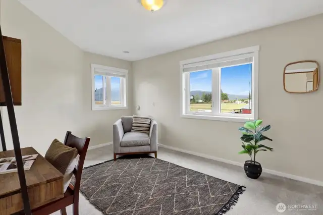 The third bedroom is staged as an office