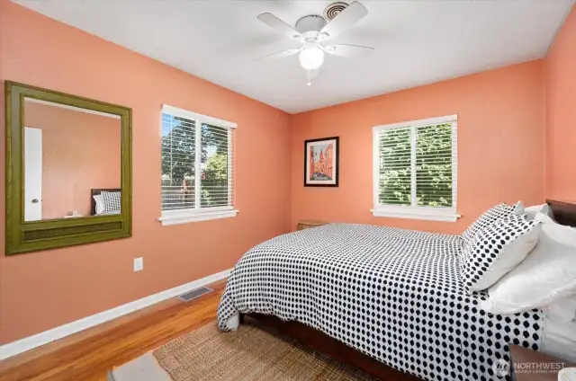 Bedroom with view of backyard and 2 closets