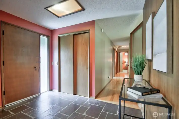 Inside - slate flooring & original paneling and interior window divider greet you with that late-50s vibe.