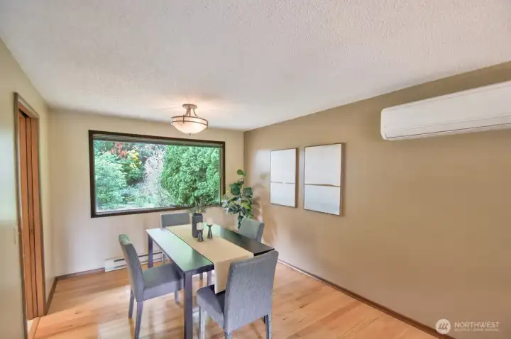 True dining room here - and yes! Energy efficient electric ductless mini-splits heat AND cool the home.