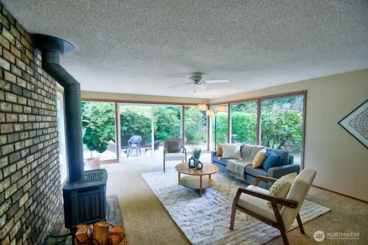 Off the kitchen, this room is a combination of rec room and sun room.