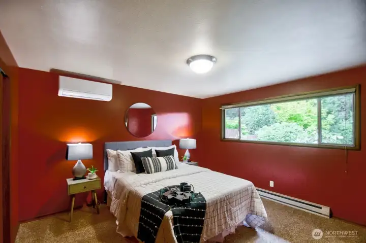 The primary suite, with backyard views out to Watershed Park.