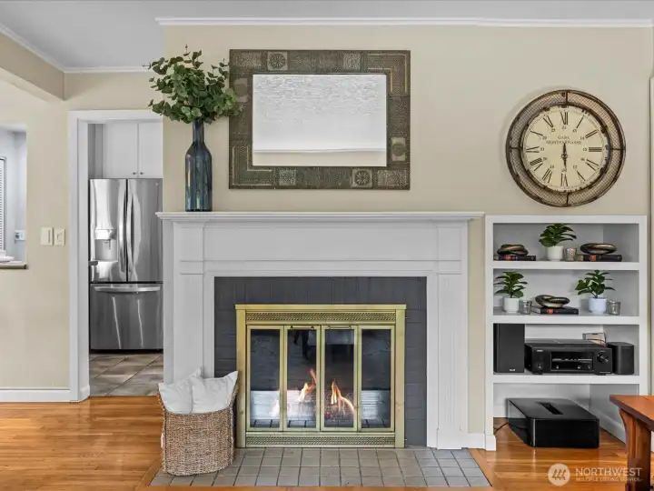 Wood-burning fireplace with gorgeous mantle and built in storage