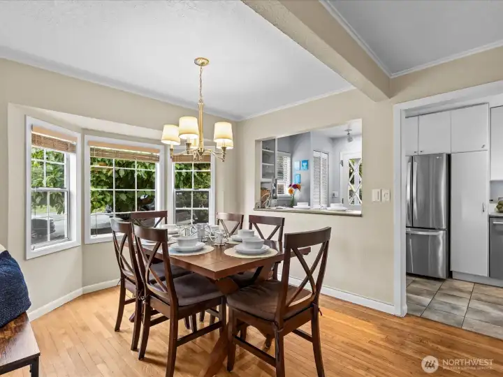 Dining adjacent to kitchen and open bar for additional eating or set up for a buffet